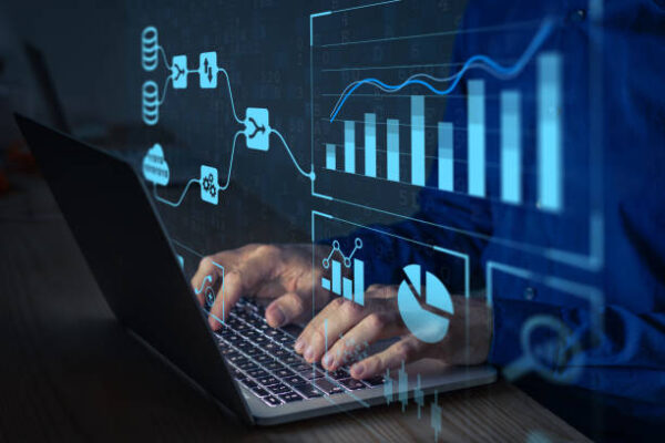 Analyst working with Business Analytics and Data Management System on computer to make report with KPI and metrics connected to database. Corporate strategy for finance, operations, sales, marketing